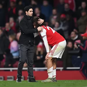 Arsenal's Mikel Arteta Embraces Matteo Guendouzi Amidst Intense Arsenal v Chelsea Rivalry (2019-20)