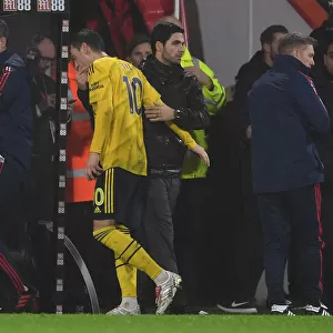 Arsenal's Mikel Arteta Embraces Mesut Ozil After Substitution during AFC Bournemouth vs Arsenal (2019-20)