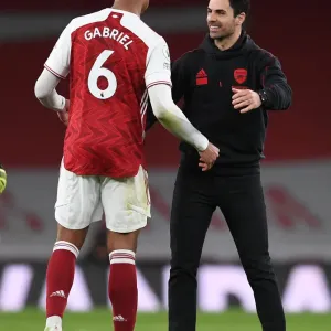 Arsenal's Mikel Arteta and Gabriel Magalhaes Celebrate Victory over Tottenham Hotspur
