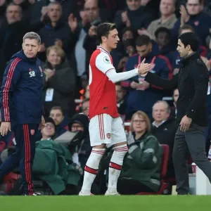 Arsenal's Mikel Arteta and Mesut Ozil Share a Moment Amidst Arsenal FC vs Chelsea FC Rivalry, Premier League 2019-20 Arsenal's Mikel Arteta and Mesut Ozil Share a Moment Amidst Arsenal FC vs Chelsea FC Rivalry, Premier League 2019-20