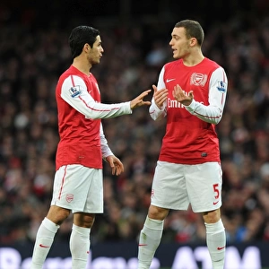 Arsenal's Mikel Arteta and Thomas Vermaelen in Action against Queens Park Rangers (2011-12)