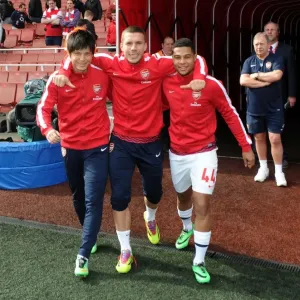 Arsenal's Miyaichi, Podolski, and Gnabry Before FA Cup Quarter-Final vs. Everton Arsenal's Miyaichi, Podolski, and Gnabry Before FA Cup Quarter-Final vs. Everton