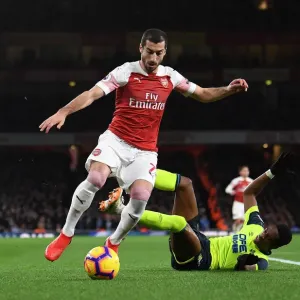 Arsenal's Mkhitaryan Clashes with Huddersfield's Kongolo in Premier League Showdown Arsenal's Mkhitaryan Clashes with Huddersfield's Kongolo in Premier League Showdown