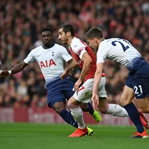 Arsenal's Mkhitaryan Clashes with Tottenham's Aurier and Foyth in Premier League Showdown