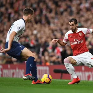 Arsenal's Mkhitaryan Clashes with Tottenham's Foyth in Intense Premier League Showdown