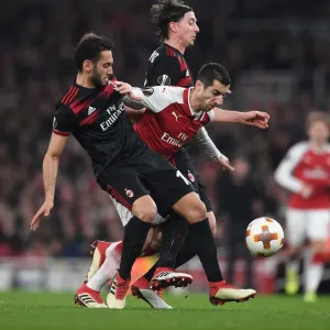 Arsenal's Mkhitaryan Goes Head-to-Head with Calhanoglu and Montolivo of AC Milan in Europa League Showdown