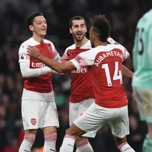 Arsenal's Mkhitaryan, Ozil, and Aubameyang: A Triumphant Goal Celebration Against Bournemouth