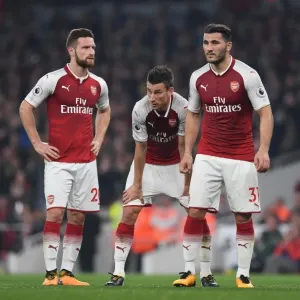 Arsenal's Mustafi, Koscielny, and Kolasinac in Action against West Bromwich Albion (2017-18) Arsenal's Mustafi, Koscielny, and Kolasinac in Action against West Bromwich Albion (2017-18)