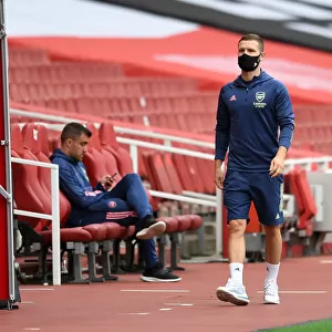 Arsenal's Mustafi Prepares for Empty Arsenal FC vs. Liverpool FC Clash (2019-20)