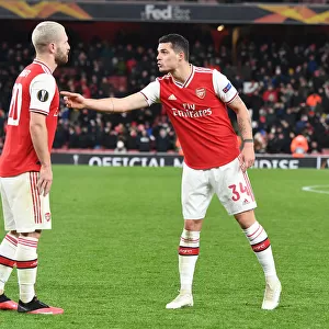 Arsenal's Mustafi and Xhaka in Action: A Europa League Battle against Olympiacos