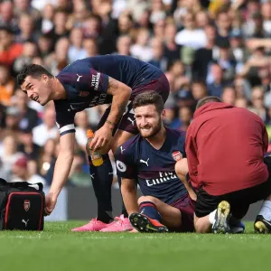 Arsenal's Mustafi and Xhaka: A Moment of Relief Amidst the Intensity of Fulham vs. Arsenal (2018-19)