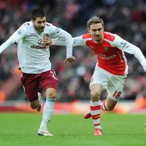 Arsenal's Nacho Monreal Holds Off Aston Villa's Carles Gil During Premier League Clash