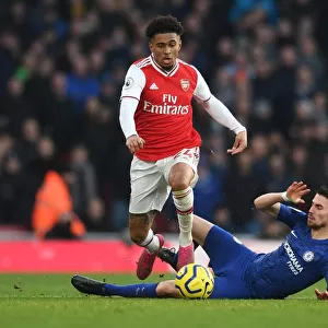 Arsenal's Nelson Clashes with Chelsea's Jorginho: A Premier League Showdown at Emirates Stadium (December 2019)
