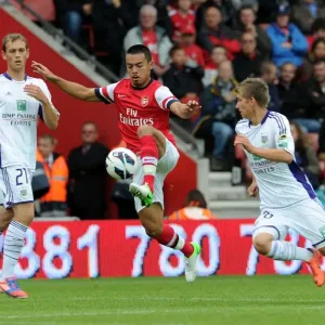 Arsenal's Nico Yennaris Faces Off Against Dennis Praet and Tom De Sutter of Anderlecht in Pre-Season Clash