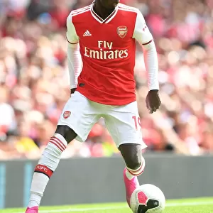 Arsenal's Nicolas Pepe in Action: A Riveting Moment from the Arsenal vs. Burnley Match, 2019-20 Premier League