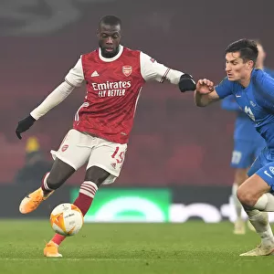 Arsenal's Nicolas Pepe Clashes with Molde's Kristoffer Haugen in Europa League Battle