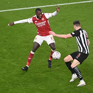Arsenal's Nicolas Pepe Clashes with Newcastle's Paul Dummett in FA Cup Third Round