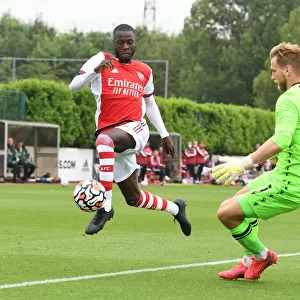 Arsenal's Nicolas Pepe Faces Off Against Millwall's George Long in Pre-Season Friendly