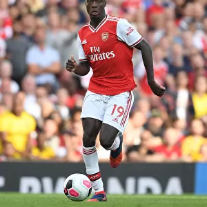 Arsenal's Nicolas Pepe Goes Head-to-Head with Tottenham in Premier League Battle