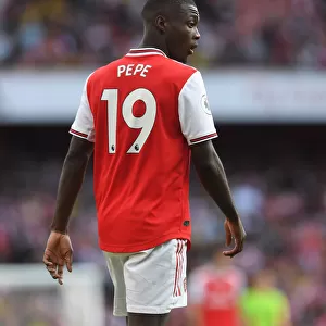Arsenal's Nicolas Pepe Goes Head-to-Head with Tottenham in Intense 2019-20 Premier League Showdown