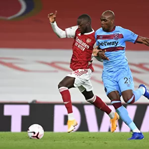 Arsenal's Nicolas Pepe Outmaneuvers West Ham's Angelo Ogbonna in Premier League Clash
