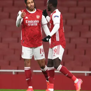 Arsenal's Nicolas Pepe and Pierre-Emerick Aubameyang Celebrate Goal in Empty Emirates Stadium during Arsenal v Slavia Prague UEFA Europa League Quarterfinal