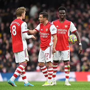 Arsenal's Odegaard, Cedric, and Saka in Action against Brentford (2021-22)
