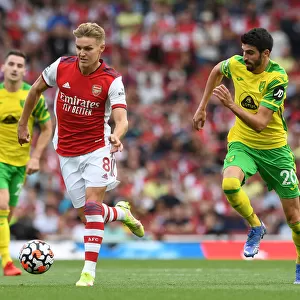 Arsenal's Odegaard Clashes with Norwich's Lees-Melou: A Premier League Showdown at Emirates Stadium