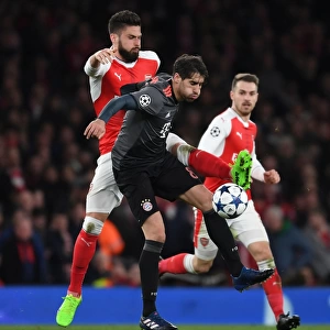 Arsenal's Olivier Giroud Clashes with Bayern Munich's Javi Martinez in Champions League Showdown
