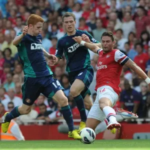 Arsenal's Olivier Giroud Clashes with Sunderland's Jack Colback in 2012-13 Premier League Match Arsenal's Olivier Giroud Clashes with Sunderland's Jack Colback in 2012-13 Premier League Match