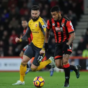 Arsenal's Olivier Giroud Closes In on AFC Bournemouth's Joshua King in Intense Premier League Clash (2016-17)