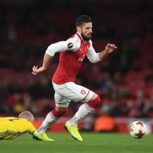Arsenal's Olivier Giroud Faces Off Against BATE Borisov's Evgeni Berezkin in UEFA Europa League Clash