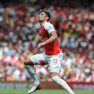 Arsenal's Olivier Giroud Faces Off Against West Ham United in Intense 2015-16 Premier League Clash