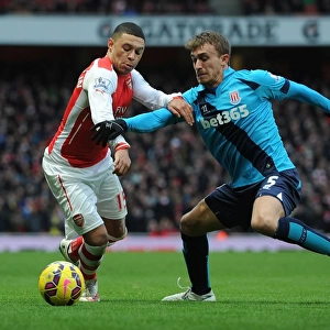 Arsenal's Oxlade-Chamberlain Faces Off Against Stoke's Muniesa in Premier League Clash