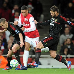 Arsenal's Oxlade-Chamberlain Fouled as Arsenal Crush AC Milan 3-0 in UEFA Champions League