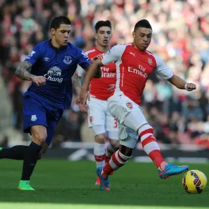 Arsenal's Oxlade-Chamberlain Outmaneuvers Everton's Besic in Premier League Clash Arsenal's Oxlade-Chamberlain Outmaneuvers Everton's Besic in Premier League Clash