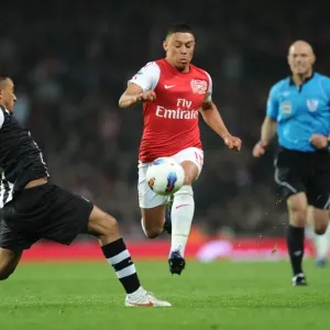 Arsenal's Oxlade-Chamberlain Outmaneuvers Newcastle's Simpson in 2011-12 Premier League Clash Arsenal's Oxlade-Chamberlain Outmaneuvers Newcastle's Simpson in 2011-12 Premier League Clash