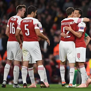 Arsenal's Ozil and Lichtsteiner: Celebrating Goals in Europa League Victory