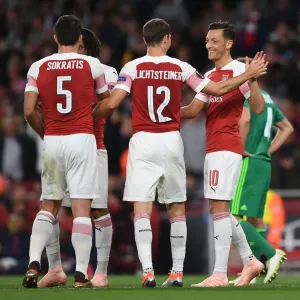 Arsenal's Ozil and Lichtsteiner: Unstoppable Duo Celebrates Goals Against Vorskla Poltava