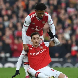 Arsenal's Ozil and Nelson: A Moment of Support Amidst Arsenal vs. Chelsea Rivalry (2019-20) Arsenal's Ozil and Nelson: A Moment of Support Amidst Arsenal vs. Chelsea Rivalry (2019-20)