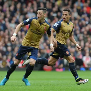 Arsenal's Ozil and Sanchez in Action: A Battle at The Boleyn Ground, West Ham United vs. Arsenal, Premier League 2015-16