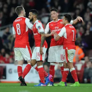 Arsenal's Ozil and Sanchez Celebrate Third Goal in FA Cup Quarter-Final vs. Lincoln City Arsenal's Ozil and Sanchez Celebrate Third Goal in FA Cup Quarter-Final vs. Lincoln City