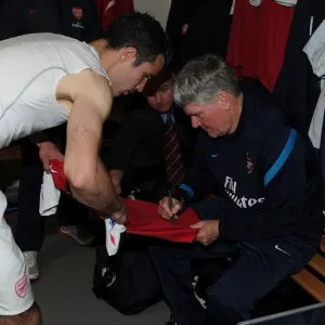 Arsenal's Pat Rice Signs Robin van Persie's Shirt after West Bromwich Albion Match (2011-12) Arsenal's Pat Rice Signs Robin van Persie's Shirt after West Bromwich Albion Match (2011-12)