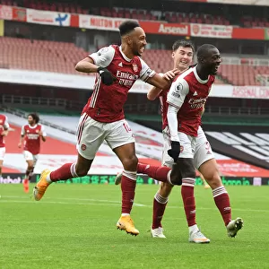 Arsenal's Pepe and Aubameyang Celebrate Goals Against Sheffield United in Empty Emirates Stadium