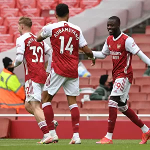 Arsenal's Pepe and Aubameyang Celebrate Goals Against Brighton in 2020-21 Premier League