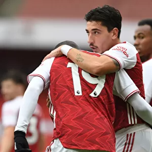Arsenal's Pepe and Bellerin Celebrate Goals in Empty Emirates Stadium Against Sheffield United (2020-21)