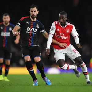 Arsenal's Pepe Clashes with Palace's Milivojevic in Premier League Showdown