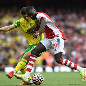 Arsenal's Pepe Fends Off Norwich's Rashica in Premier League Clash