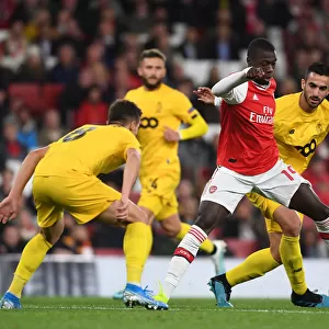 Arsenal's Pepe Goes Head-to-Head with Standard Liege's Cimirot in Europa League Showdown