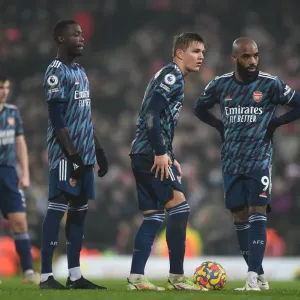 Arsenal's Pepe, Odegaard, and Lacazette in Action against Norwich City (Premier League 2021-22) Arsenal's Pepe, Odegaard, and Lacazette in Action against Norwich City (Premier League 2021-22)